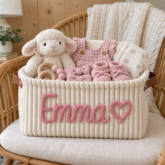 Cream corduroy basket with the name Emma and a heart in pink yarn